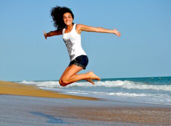woman, beach, nature, jump, happy woman, female, happy, smiling, smile, waves, sand, sea, ocean, ocean waves, brunette, brunette woman, jumping girl, shore, seashore