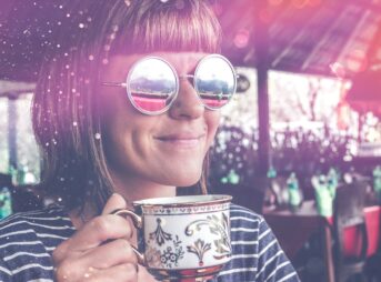 woman holding teacup