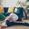 Woman stretching on floor in a living room