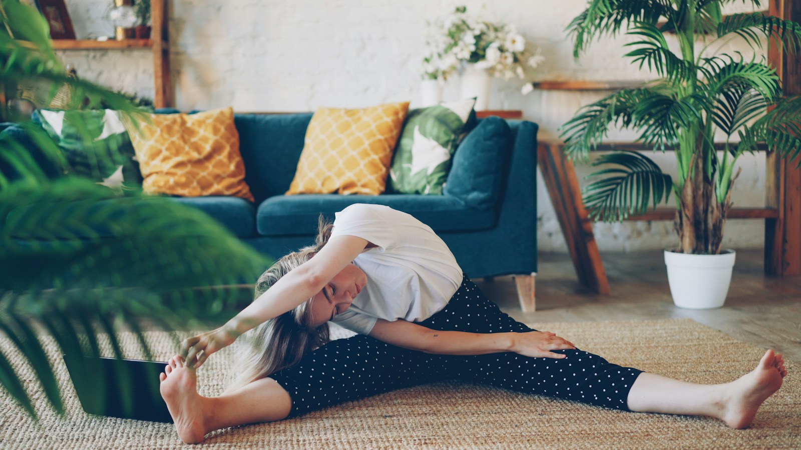 Woman stretching on floor in a living room