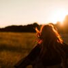 woman standing on grass field