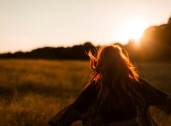woman standing on grass field