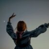 a person with the hands up
