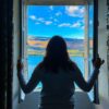 a person looking out a window