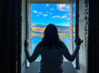a person looking out a window
