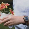 person wearing gold ring and gold ring